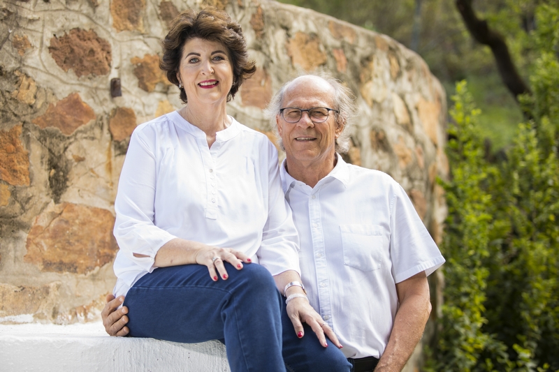 Couple portrait against stone wall