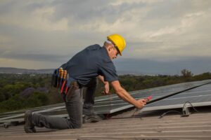 Industrial photography_technician testing solar panels Industrial photography_technician testing solar panels