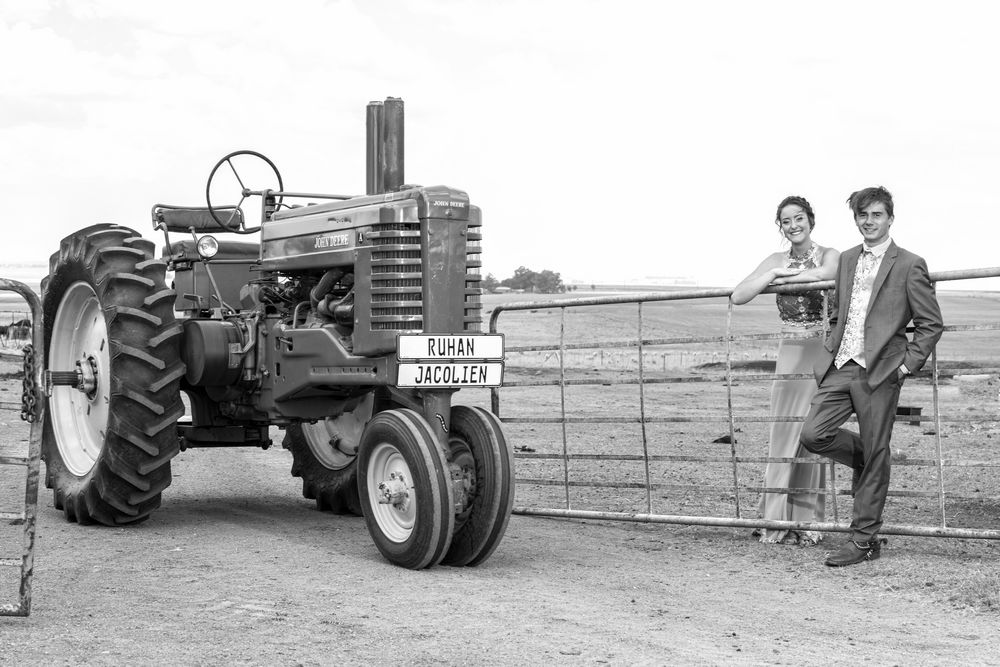 Lifestyle matric farewell photography with vintage John Deere tractor