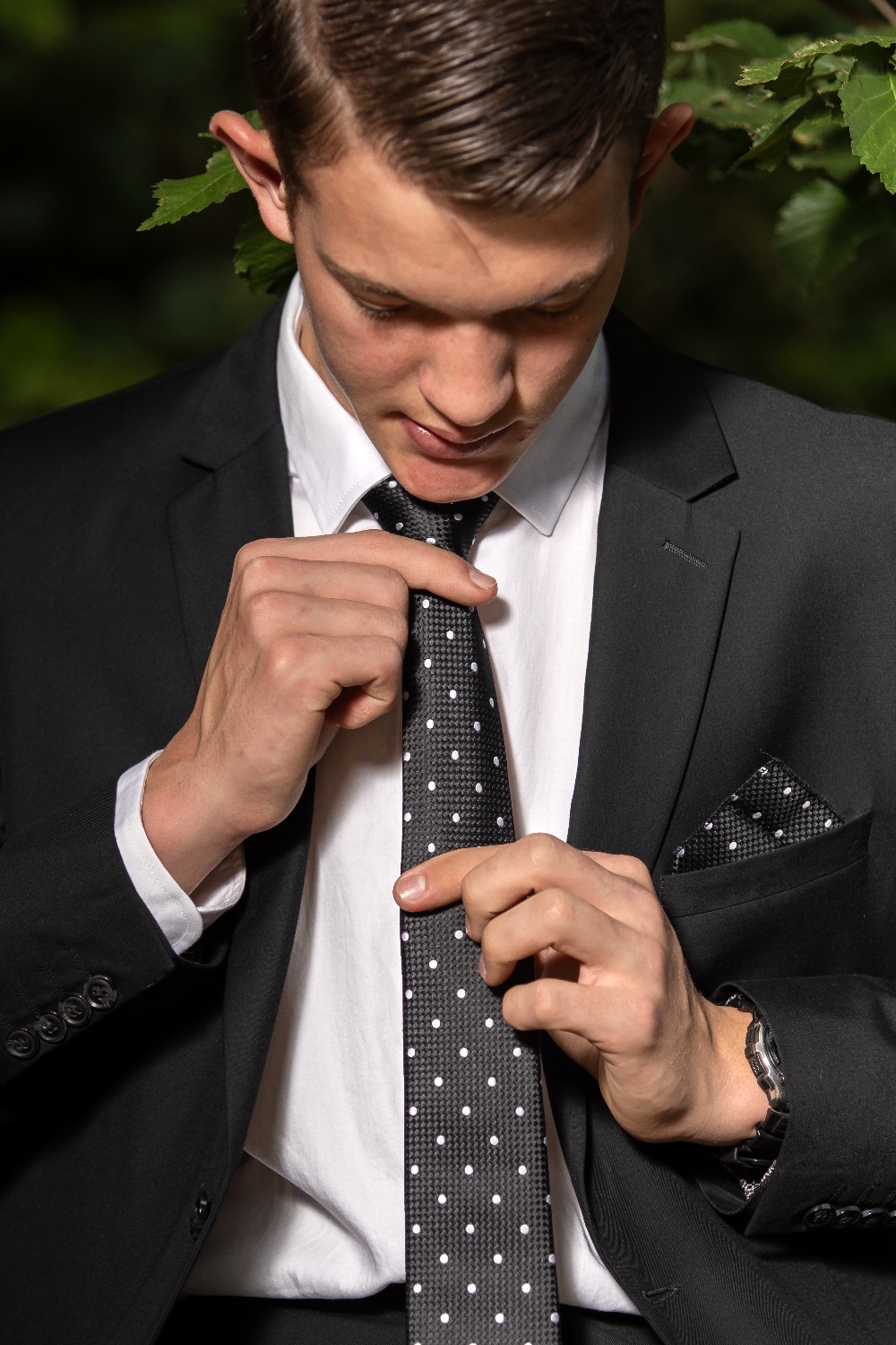 Matric farewell _ young man holding his tie