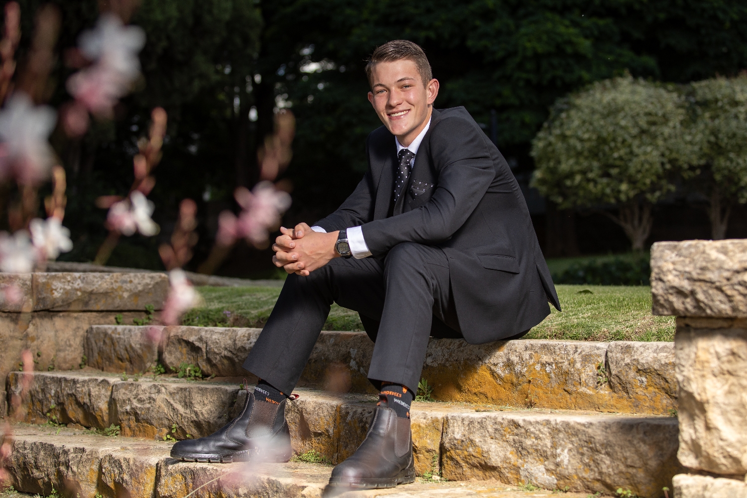 Matric farewell _ young man sitting on stairs