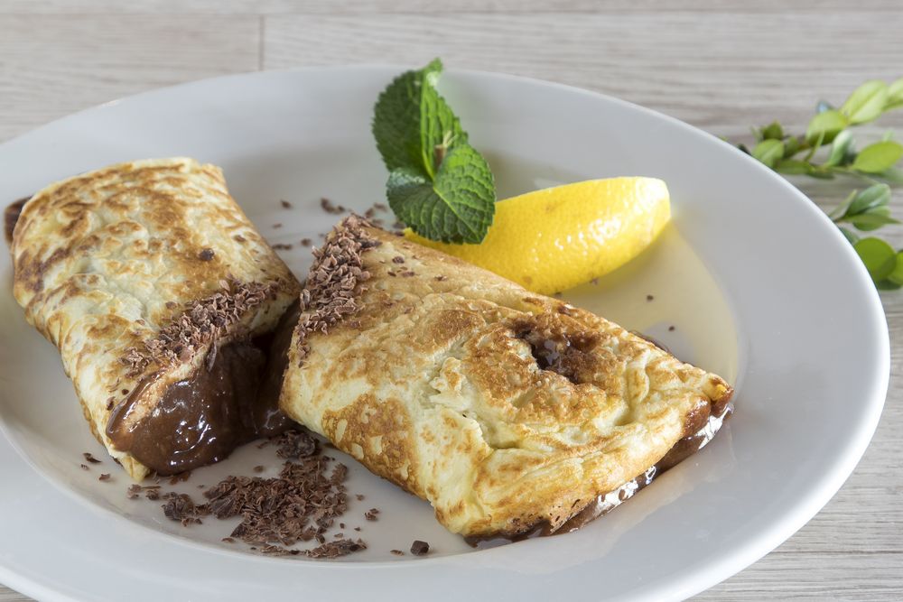 Restaurant menu photography_Dark Chocolate Mousse Pancake_closeup Restaurant menu photography_Dark Chocolate Mousse Pancake_closeup