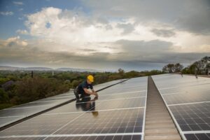 Technician installing solar panels_industrial photograpy Technician installing solar panels_industrial photograpy