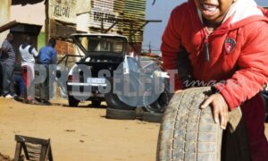 Township kid rolling tyre | ProSelect-images
